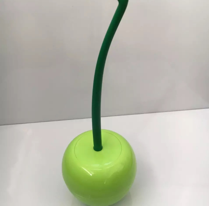 Brosse tête cerise de toilette.
